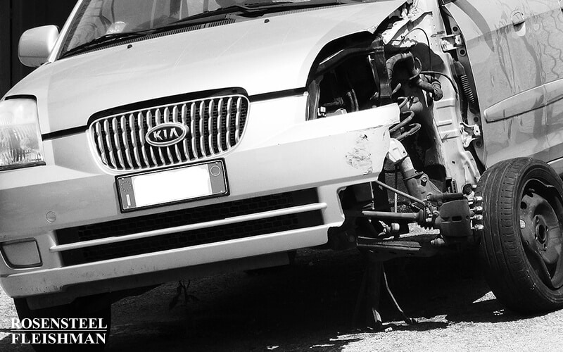 Wrecked Car with a Damaged Wheel