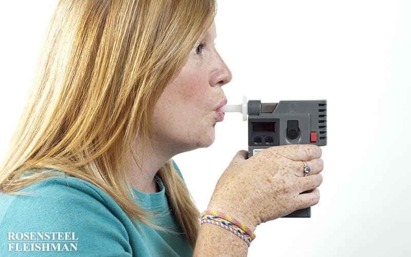 Woman Taking DWI Breath Test