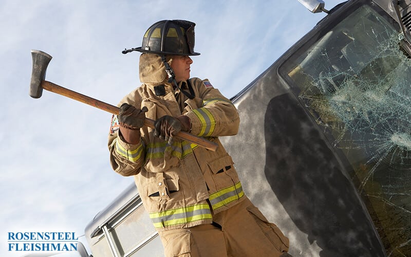 Firefighter Helping Victim of a Car Accident