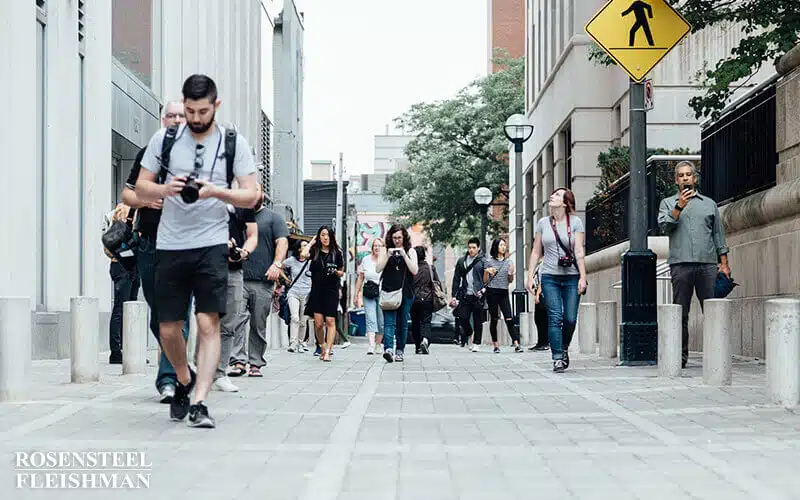 Pedestrians Crossing the Road at a Crosswalk