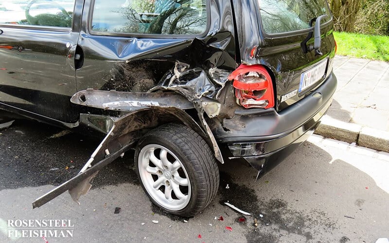 Car with a Damaged Rear Quarter Panel After an Accident