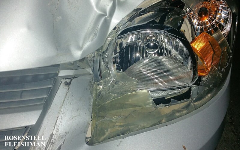 Wrecked Auto with a Damaged Headlamp